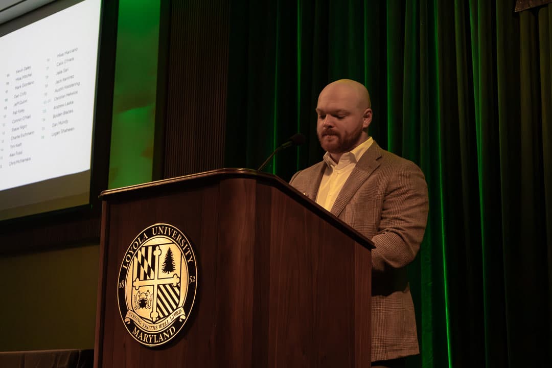Chris McNamara '15 at the podium recognising the past Loyola Rugby presidents