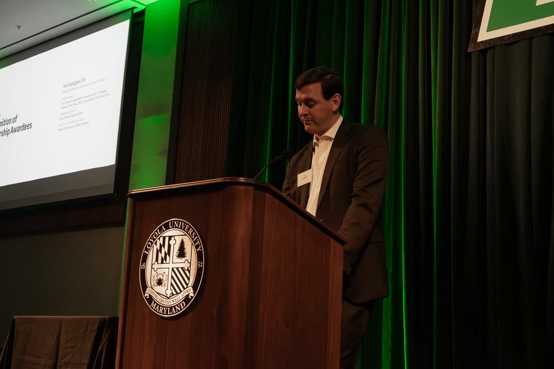 Tom Callaghan '16 at the podium recognising the scholarship awardees