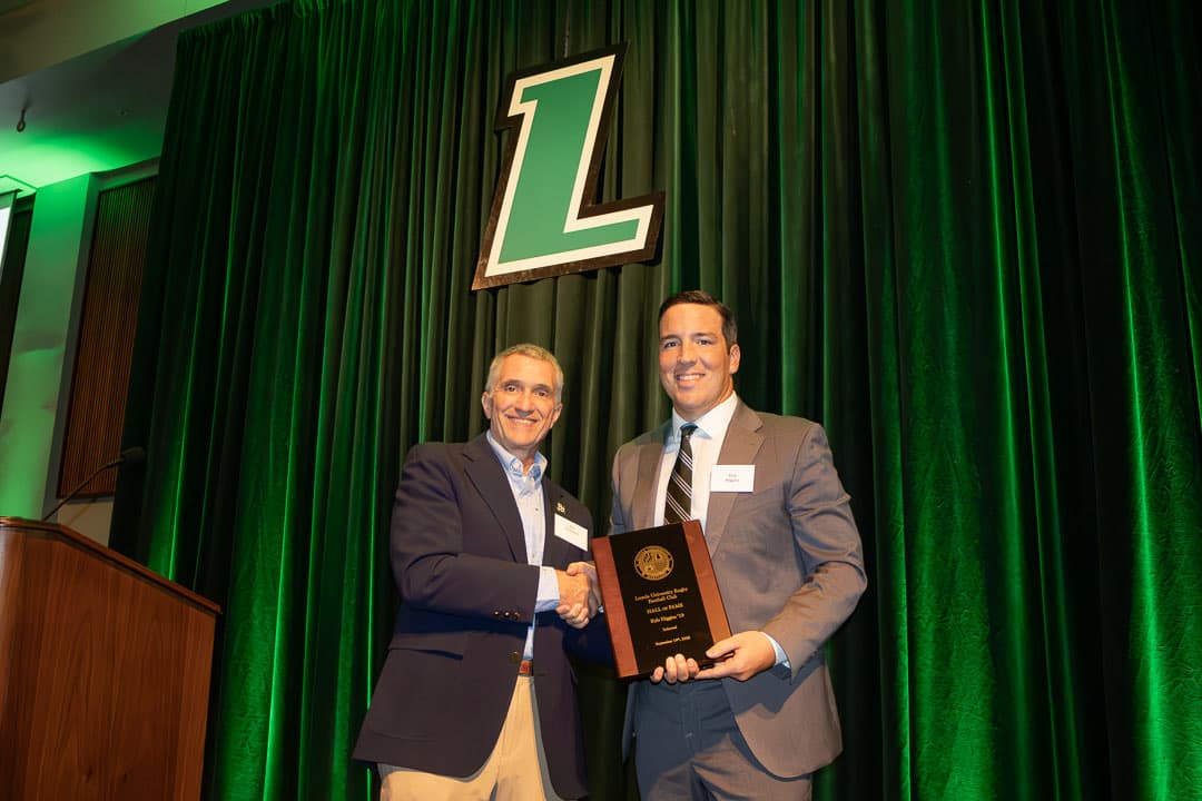 Kyle Higgins '19 receiving his Hall of Fame plaque