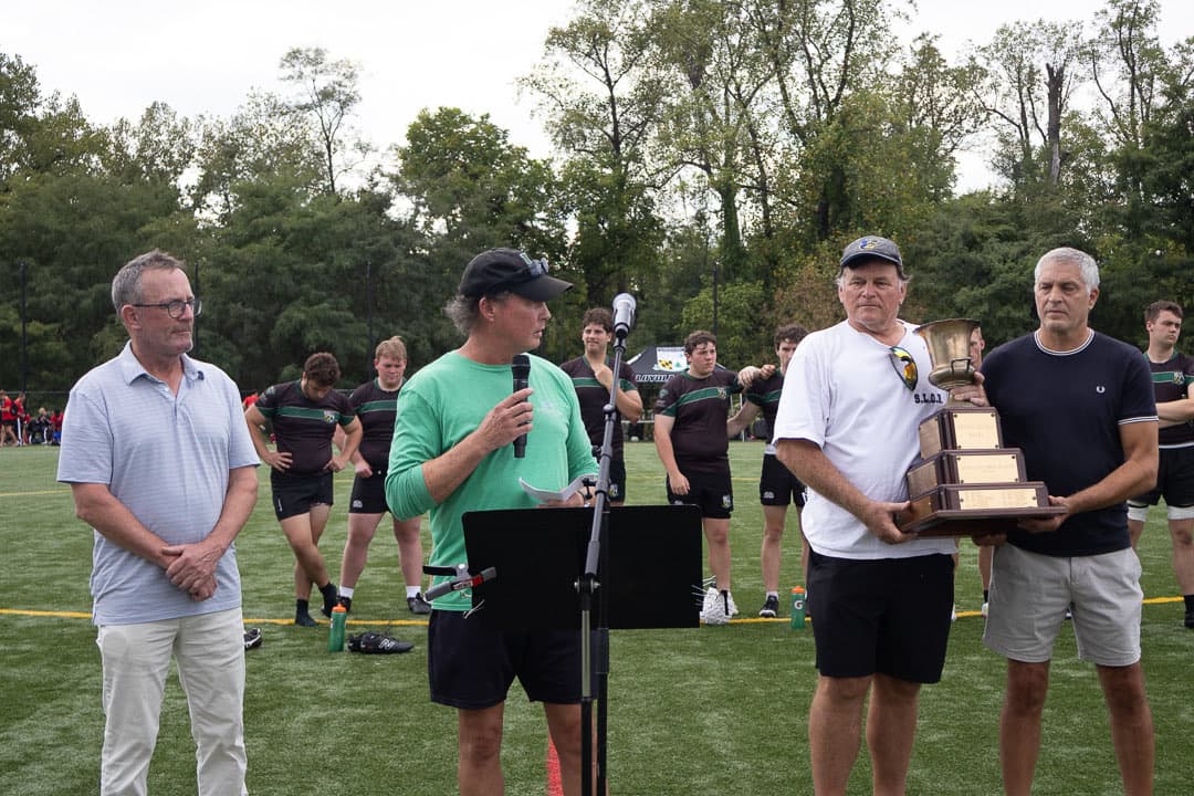 Jamie Caulfield, Kenny Ames, John Molli and Victor Norris with the Loc Vetter perpetual trophy on Lugano Field